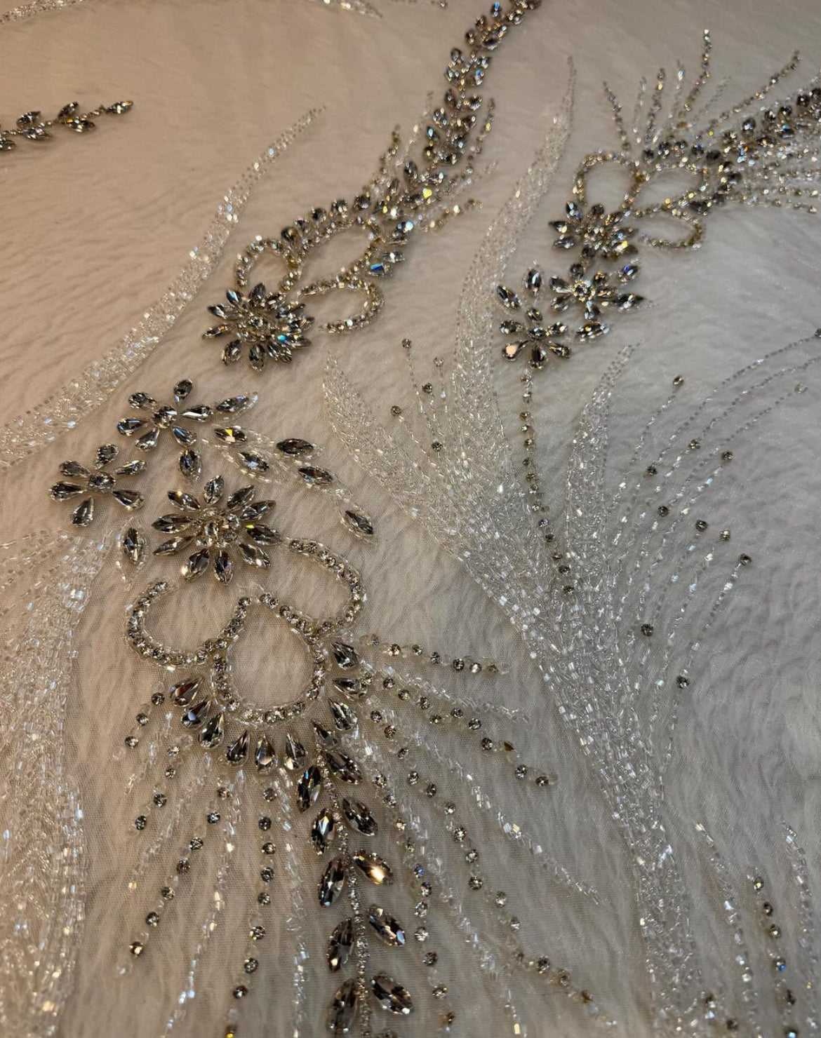 Ethereal Elegance: Hand-Embroidered Ivory Mesh Fabric with Shimmering Details