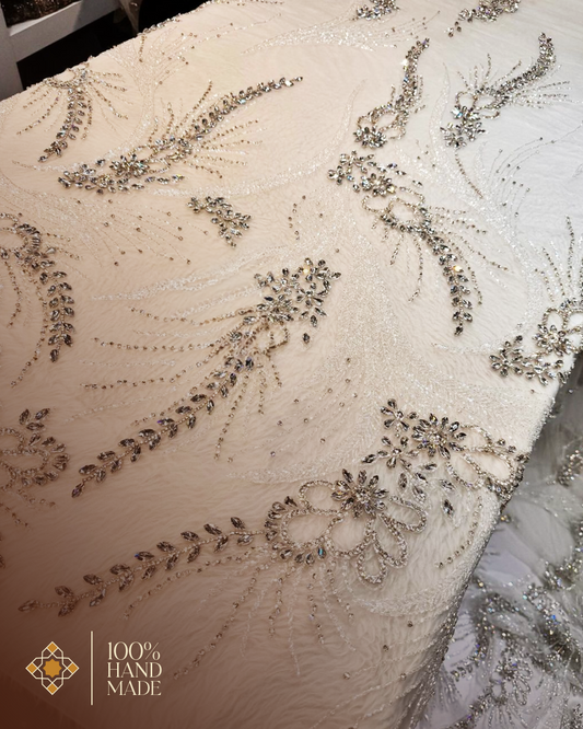 Ethereal Elegance: Hand-Embroidered Ivory Mesh Fabric with Shimmering Details