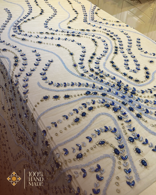 Ethereal Elegance: Hand-Embroidered Tulle Fabric with Flowing Patterns