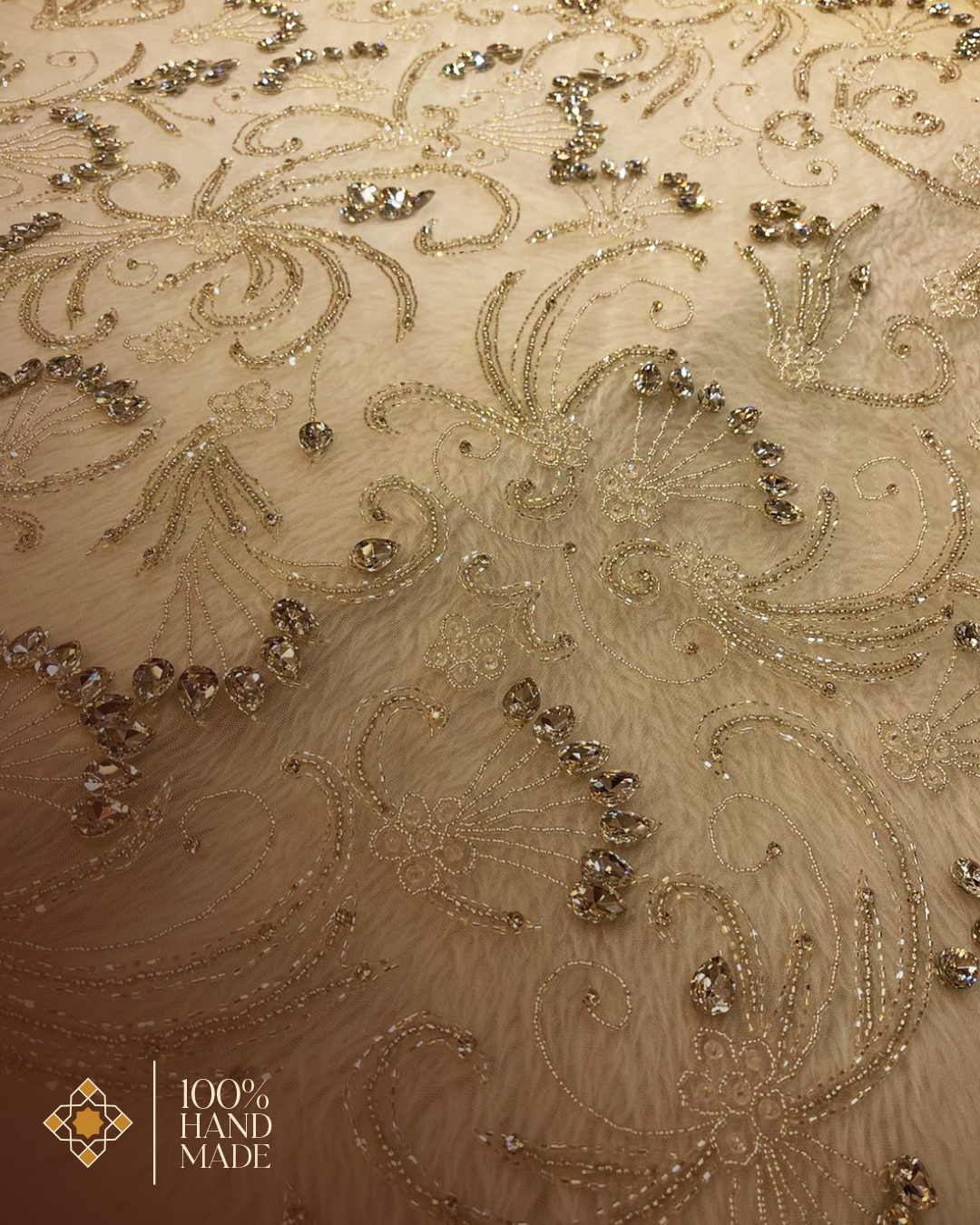 Ivory Elegance: Luxurious Hand-Embroidered Fabric with Shimmering Silver Details