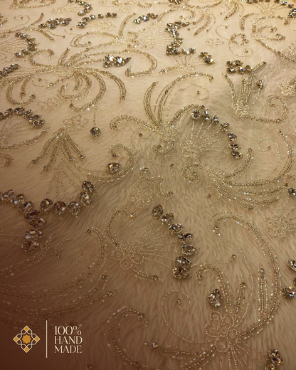 Ivory Elegance: Luxurious Hand-Embroidered Fabric with Shimmering Silver Details